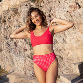 Model wearing pink bikini bottoms - albion has the best swimming suits for women