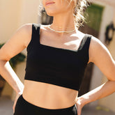 Close up front view of sporty black bikini top in plush terry towel fabric