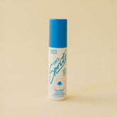 Front view of Vacation Super Spritz SPF 50 Face Mist showcasing its blue cap and product label with a beige background