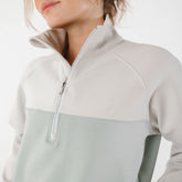 Close up view of two tone half zip sweatshirt