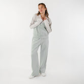 Front view of model wearing womens matching set with quarter zip pullover and wide leg sweatpants