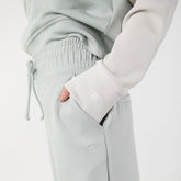 Close up of Albion logo details on matching sweat set in neo fabric