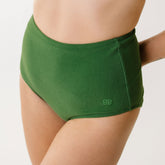 Close up details of green swim bottoms with high waist in italian terry material