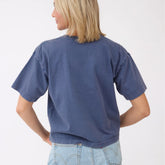 Back view of the blue Perfect Oversized Cotton Tee showcasing its oversized fit and short sleeves with a white background