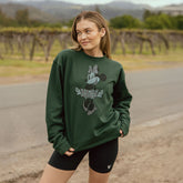 Model wearing dark green Disney sweatshirt. Crewneck Minnie Mouse sweatshirt that is oversized and muted colors.