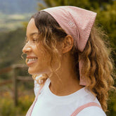 Model wearing red bandana with matching red jumpsuit. Red seersucker fabric, cute bandana for summer.