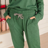 Close up front view of women's green matching sweat set