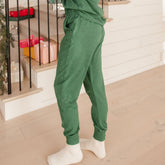 Side view of soft women's joggers in green with matching hoodie