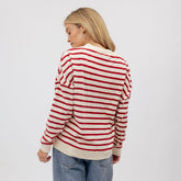 Back view of Utah Cardigan in red stripe worn by a model against a light gray background