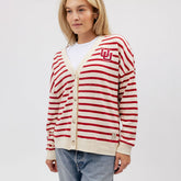 Front view of Utah Cardigan showcasing red and cream stripes, button front, and U logo on a model