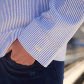 Close-up of BYU Striped Collar Zip-Up Jacket showcasing striped cuff and embroidered BYU logo on a model