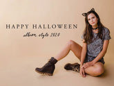 Woman in a leopard-print outfit and cat ears sits in boots for a Halloween fashion look, with “Happy Halloween” text