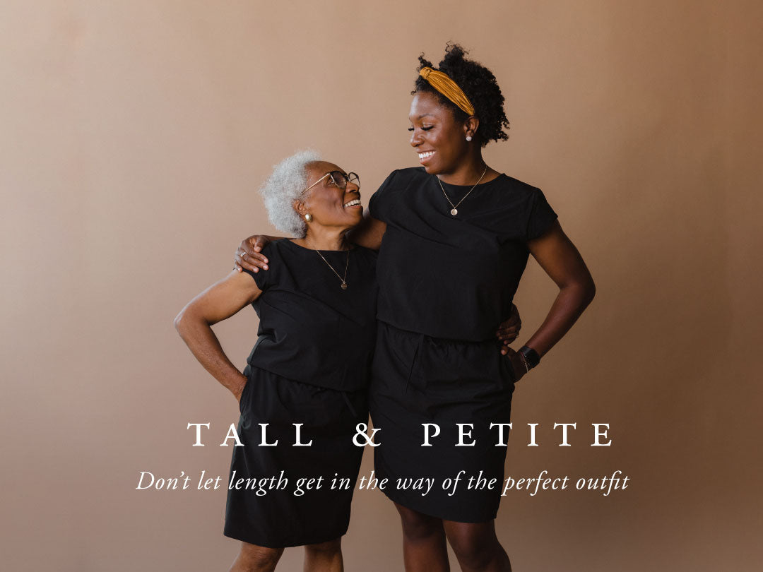 Two women in black outfits stand together, highlighting tall and petite styling against a warm brown backdrop