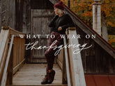 Woman poses in burgundy pants on a wooden bridge in autumn with overlay text What to wear on Thanksgiving