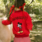Close up back view of child wearing a kid's Mickey Mouse jacket—the perfect kids Disney jacket with embroidered Mickey mouse on the back.