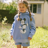 Young child wearing a cute kid's Mickey sweatshirt in sky blue with matching shorts. 