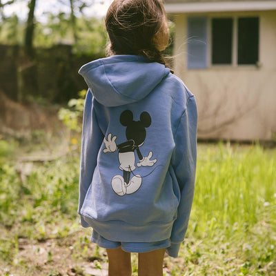 Close up back view of child wearing a cute kid's Disney hoodie—the perfect kids Disney sweatshirt with screen printed Mickey Mouse. 