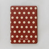 Polka dot tablet case with a visible brand logo on a white background
