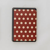 Polka dot patterned case on a white background