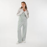 Front view of model wearing womens matching set with quarter zip pullover and wide leg sweatpants 