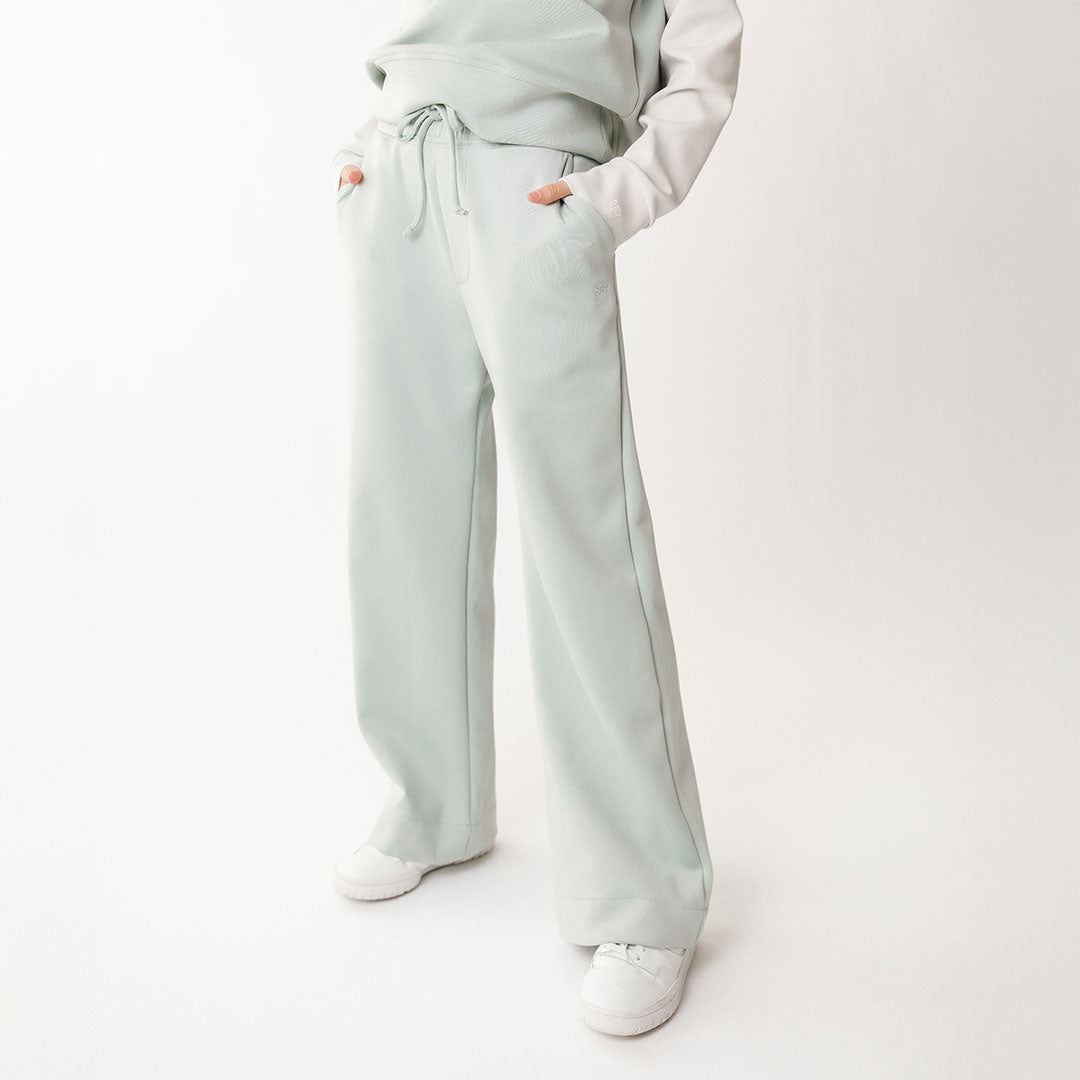 Close up front view of wide leg sweatpants in neo fabric with soft mint color
