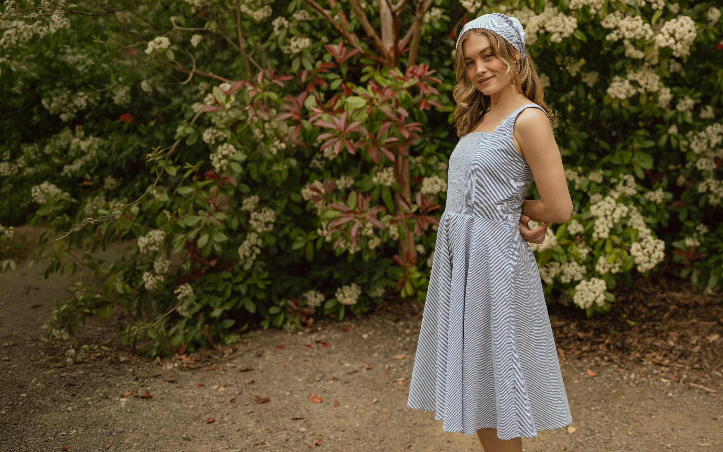 Girl wearing blue striped dress