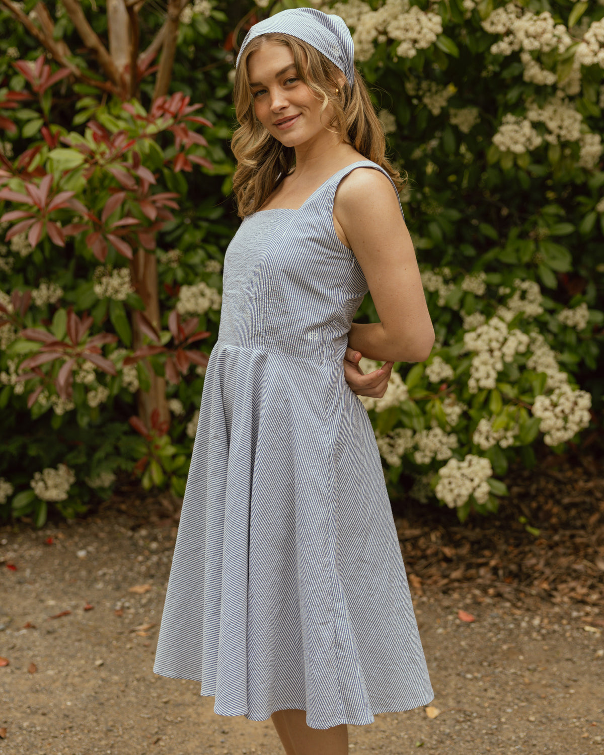 Girl wearing blue striped dress