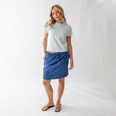 Front view of City Skirt in blue and blue polka dot print worn by a model against a white background