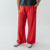 Front view of Slip On Trouser, Red Polka Dot showcasing side pockets and wide legs with a light gray background