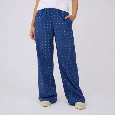 Front view of blue polka dot Slip On Trouser showcasing wide legs and side pockets on a model against a light gray background