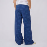 Rear view of blue polka-dot Slip On Trouser showcasing wide-leg fit on a model against a light background