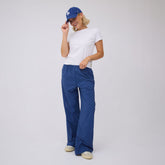 Front view of blue and blue polka dot slip on trouser showcasing the fit on a model against a light background