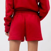 Red sweatshirt and shorts set on a white background