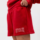 Red shorts with 'UTAH' text on a plain background