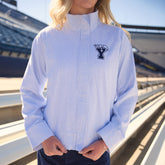 Front view of BYU striped collar zip-up jacket showcasing light blue and white stripes and BYU logo on a model at a stadium