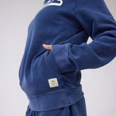 Close-up of navy BYU Campus Hoodie, Cougars showcasing ribbed cuffs, hem, and Albion tag on a model