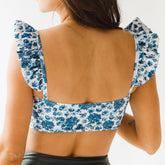 Back view of ruffles and swim crop top blue and white