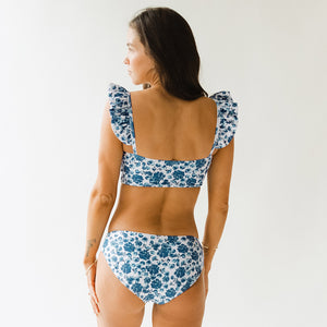 Back view of beautiful floral blue and white two-piece swimsuit