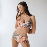 woman wearing a bralette swimsuit set by Albion Fit