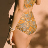 Side view of model in swim bottoms Golden Hour