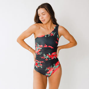 Model stands wearing one-piece swimsuit by Albion Fit