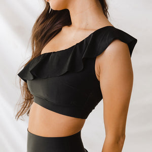 Close of of woman wearing a off the shoulder swim top