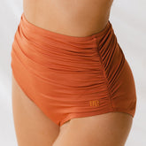 model in Ruched High-Waisted swim bottoms