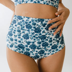 Front angle of floral pattern on white swim bottoms