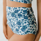 Close up of blue floral and white ruched high waisted swimsuit bottoms