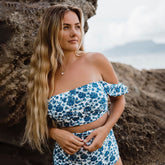 Woman wearing bandeau off the shoulder swimsuit