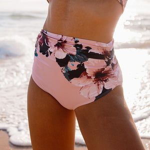 close up of pink floral design high waisted swim bottoms