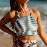 close up of two-piece swimsuit with green and white stripes 