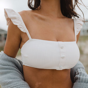 woman wearing white off the shoulder two piece swimsuit by Albion Fit