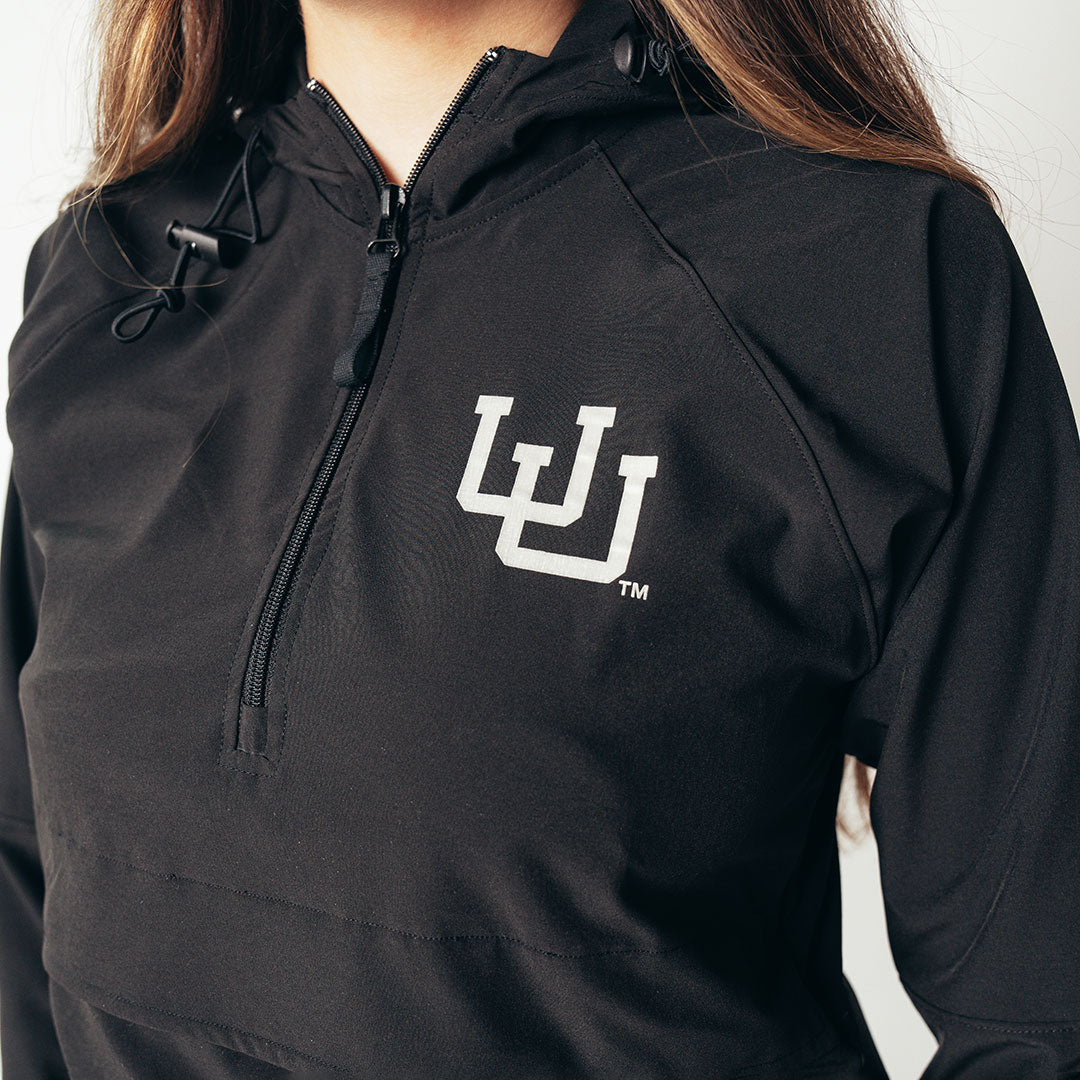 Close-up of a black quarter zip hoodie with the University of Utah logo in white.